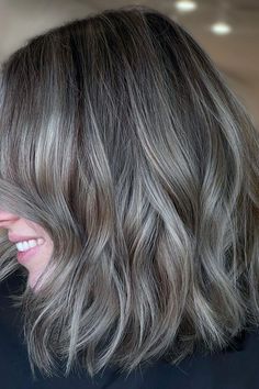 Medium-length layered cut with ash blonde balayage offers texture and volume, perfect for an elegant yet modern look. The darker roots blend seamlessly into lighter ends, creating a beautiful depth and dimension.  // Photo Credit: Instagram @skylacolors Shoulder Length Hair Ash Blonde, Shoulder Length Gray Hair, Darker Balayage, Cool Ash Blonde Balayage, Light Ash Brown Hair With Highlights, Ash Gray Balayage, Ash Brown Hair With Highlights, Ashy Balayage, Dark Balayage