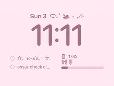 a pink clock with the time 11 11 on it's face and numbers below