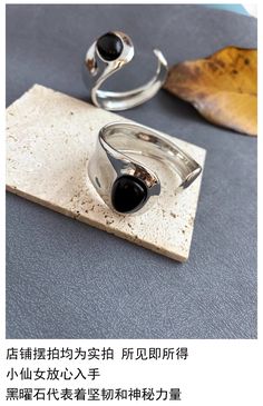 Make a bold, contemporary statement with the Midnight Black Onyx Bracelet. This striking piece features a glossy black onyx gemstone set in a fluid, polished metal band, perfect for adding a sleek touch to your look. Whether you're dressing up or down, this ring complements both casual and formal outfits, making it a versatile must-have in your jewelry collection. Details Material: Black Onyx and polished alloy, not fading metal Size: Adjustable band for a perfect fit Bold and sleek modern design Ideal for minimalist and modern styles Lightweight and comfortable for all-day wear Perfectly pairs with other contemporary pieces for a chic look Matched with Midnight Black Onyx Modern Ring Missy Jewelry Midnight Collection Black Onyx Bracelet, Pearl Jewelry Necklace, Natural Stones Necklace, Gold Statement Earrings, Formal Outfits, Onyx Bracelet, Natural Stone Jewelry, Chunky Rings, Natural Stone Bracelets