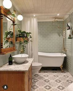 a bath room with a toilet a tub and a sink