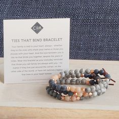 Ties That Bind Mini Bracelet | A reminder of the ones you call family. A mini meaningful bracelet with Dumortierite, Sunstone, and Gray Picture Jasper gemstones. BRACELET MEANING Your family is tied to your heart, always - whether they’re the ones who share your name or those you choose with your heart. And the love between you is the tie that binds you together, despite the years or miles. Wear this bracelet as your everyday reminder that those you call family are always with you - no matter if Meaningful Heart-shaped Bracelets For Mother's Day, Spiritual Multi-strand Bracelet With Tiny Beads, Inspirational Personalized Heart-shaped Bracelets, Artisan Hand-strung Healing Bracelet, Family Bracelets, Intention Bracelets, Mini Bracelet, Grey Pictures, Ties That Bind