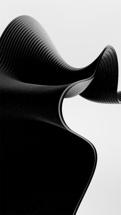 an abstract black and white photo of wavy lines on the surface, with one curved object in the foreground