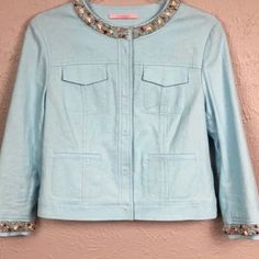 This Is A Cute Cropped Light Blue Jacket. The Jacket Has Beading And Stones Lining The Neck And Sleeves. The Jacket Is In Excellent Condition With Tags. There May Be 2 Loose Beads, But They Are Not Noticable. The Jacket Has Snap Closures Down The Front And On The Sleeves. Fabric Is Linen, Rayon, And Spandex. Spring Embellished Outerwear For Work, Spring Embellished Workwear Outerwear, Blue Embellished Fitted Outerwear, Fitted Blue Embellished Outerwear, Spring Blue Beaded Outerwear, Fall Blue Beaded Outerwear, White Jean Vest, Knitted Jackets Women, Green Tuxedo