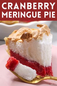 a slice of cranberry meringue pie on a pink plate with a gold fork