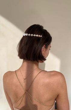 The Allison Pearl Halo is a timeless headpiece that will elevate your look. With gradual sized pearls on a 14 karat gold plated headband, this halo can be worn on the back of your head as a halo or at the nape of your head as a crown. Made in NYC Elegant Teardrop Crown Headpiece For Gifts, Elegant Headpiece With Teardrop Crown For Gift, Elegant Headpieces With Teardrop Crown For Gift, Elegant Adjustable Hair Accessories For Formal Events, Elegant Teardrop Crown Wedding Headpiece, Formal Pearl Bridal Accessories, Formal Bridal Accessories With Pearl, Formal Bridal Pearl Accessories, Elegant Headpiece With Pinched Crown For Gift