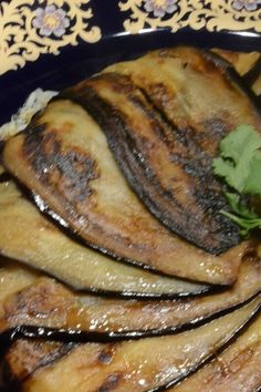 the food is prepared and ready to be eaten on the plate with parsley in it