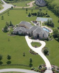 an aerial view of a large home in the country