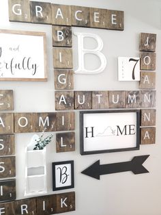 the wall is decorated with wooden scrabbles and letters