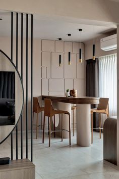 a dining room table surrounded by chairs and barstools