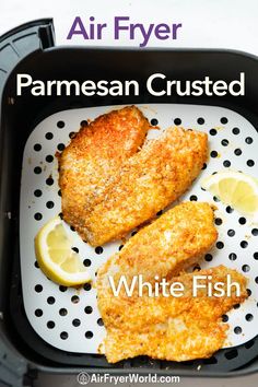 air fryer parmesan crusted white fish with lemon wedges on the side