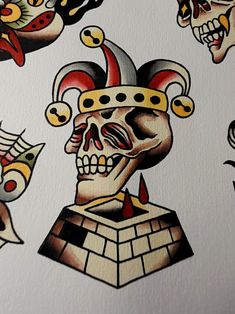 an image of some tattoos on the back of a white wall with skulls and clown faces