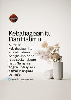 a white vase filled with flowers on top of a table next to a sign that says kebahagann tu dari hatmu