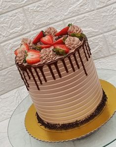 a cake with chocolate frosting and strawberries on top