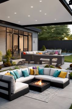 Modern backyard patio with comfortable seating, fire pit, and dining area under a covered pergola. Cozy Sitting Area, How To Install Pavers