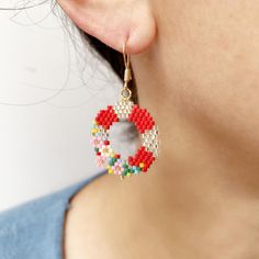 Add a touch of festive cheer to your holiday ensemble with these Beaded Christmas Wreath Earrings. Handcrafted using delicate seed beads, these drop earrings are a unique and eye-catching accessory. Whether you're treating yourself or looking for a meaningful present for Mom, Sister, or friends, these earrings are sure to make a lasting impression. Perfect for adding a festive flair to any outfit, these earrings are a delightful Christmas gift that will be treasured for years to come. Drop Size: 28X24mm Material: Miyuki Dedica beads Beaded Christmas Wreath, Wreath Earrings, Christmas Gift For Mom, Sister Friends, Presents For Mom, Beaded Drop Earrings, Christmas Door Decorations, Mom And Sister, Earrings Unique