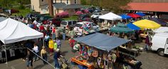 an aerial view of a market with tents and vendors