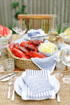 lobsters and watermelon are served in baskets on the table for guests to eat