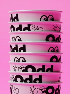 five pink and white bowls with black letters on them against a bright pink background that says blob