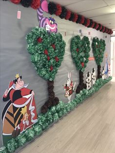 an office decorated with paper mache trees and decorations