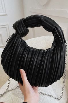 Details: Get ready to make a statement with the State of Chic Pleated Hobo Handbag! Made with high quality vegan leather and featuring a knotted woven design, this bag is both stylish and sustainable. The adjustable and detachable metal strap gives you versatile wearing options, while the chic top handle adds a touch of elegance. Upgrade your handbag game with this unique and fashionable piece. - Zip top - Crossbody strap Content: 100% PU leather Approximate Measurements: 7.9" height x 10.2" wid Trendy Evening Shoulder Bag With Braided Handles, Trendy Party Bags With Braided Handles, Rectangular Faux Leather Shoulder Bag For Fashion, Trendy Evening Hobo Bag With Braided Handles, Black Faux Leather Fashion Bags, Chic Party Bags With Braided Handles, Chic Shoulder Bag With Loop Closure, Chic Party Shoulder Bag With Braided Handles, Elegant Black Woven Hobo Bag