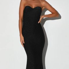 You'll Be Catching Compliments All Night Long In The Lulus Hot Pursuit Black Metallic Strapless Mermaid Maxi Dress! Textured Stretch Knit, With Metallic Threading Throughout, Creates A Sparkling Glitter-Like Effect As It Hugs Your Figure From A Strapless, Sweetheart Neckline (With Hidden No-Slip Strips), Down A Princess-Seamed Bodice, Empire Waist, And A Slinky Mermaid-Style Maxi Skirt. Slight High-Low Hem. Hidden Back Zipper/Clasp. Fully Lined. Dress Measures 5" Longer At Back. Self: 95% Nylon, Strapless Mermaid Dress For Gala, Glamorous Strapless Mermaid Dress For Gala, Strapless Glamorous Mermaid Dress For Gala, Fitted Strapless Mermaid Dress For Gala, Strapless Fitted Mermaid Dress For Gala, Strapless Mermaid Dress For Evening, Glamorous Strapless Mermaid Evening Dress, Sleeveless Black Mermaid Dress For Prom, Black Sleeveless Mermaid Dress For Prom