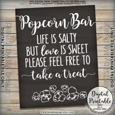 the popcorn bar chalkboard sign is shown on a wooden background with text that reads popcorn bar