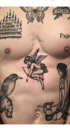 a man's chest with tattoos on it, including a bird and cupid