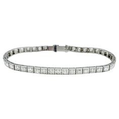 The inner circumference of this bracelet measures 6.13 inches and will comfortably fit up to a 6 inch wrist. This stunning vintage diamond tennis bracelet is exquisitely crafted in platinum with a sophisticated squared design and intricate milgrain texturing. This incredible bracelet features a continuous line of brilliant Old Mine and round cut diamonds, each set in a meticulously detailed squared frame. The milgrain texturing along the edges adds to the vintage charm and enhances the overall elegance of the piece. The platinum setting provides a luxurious backdrop for the diamonds, ensuring a timeless and refined look. Perfect for special occasions or adding a touch of glamour to everyday wear, this diamond tennis bracelet is a timeless addition to any fine jewelry collection. This piece Bracelet Tennis, Old Mine Cut Diamond, Diamond Tennis Bracelet, Continuous Line, Tennis Bracelet Diamond, Fine Jewelry Collection, Vintage Diamond, Tennis Bracelet, Diamond Clarity