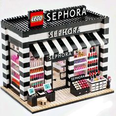 a lego store with black and white striped awnings, shelves filled with cosmetics