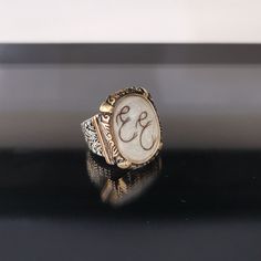 "✓ Personalized Hair Locket Initial Ring For Men. Our Solid 925 Sterling Silver ring with; %100 hand crafted, gold workmanship is specially produced for you, Jewelry made with love for your special occasions. ---● R I N G ∙ D E T A I L S ●--- * The Case Of The Ring is SOLID 925 STERLING SILVER. * The upper part of the ring is made of UV stable resin. And your hair will be safe in it. * We create letters/designs by hand crafted by separating your hair into strands. * The shapes of the letters/des Hair Locket, Jewelry Kids, Cremation Ring, Lock Of Hair, Hair Locks, Couple Items, Hair Rings, Initial Ring, Kids Hair