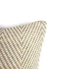 a close up of a pillow on a white background