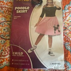 a package with scissors on top of it that says, poodle skirt sewing pattern