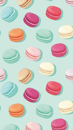 colorful macaroons are scattered on a blue background