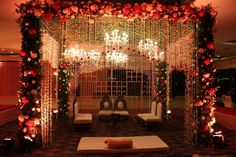 a room decorated with flowers and candles for a wedding or special occasion in the evening