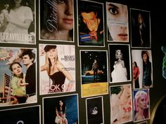 a wall covered with posters and pictures of women in different styles, sizes and colors