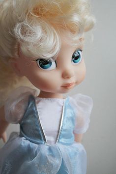 a doll with blonde hair and blue eyes