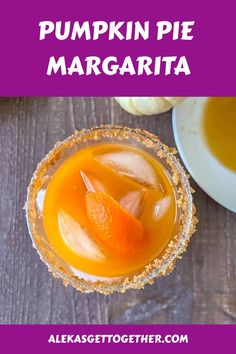 pumpkin pie margarita in a glass with orange garnish on the rim and text overlay that reads pumpkin pie margarita