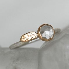 a close up view of a gold ring with a faceted stone on the side