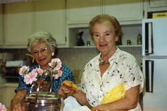 two older women in the kitchen preparing food