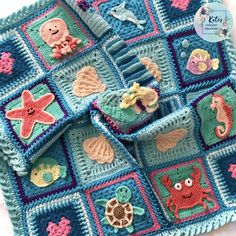 a crocheted blanket with sea animals and other items on it is shown in the shape of a square