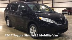 a black toyota sienna is parked in a garage with other cars behind it and the words toyota sienna e mobility van