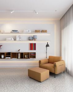 a living room with two chairs and a book shelf on the wall above it,