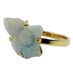 an opalite ring set in yellow gold