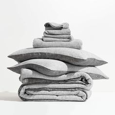 a stack of pillows sitting on top of each other