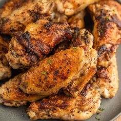 grilled chicken wings on a plate with parsley