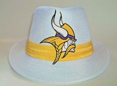 Strike your best pose with this Minnesota Vikings Fan Fedora hat. You have to add it to your sporty stylish look for this football season. It's an ADULT size hat that is for both men and women. Get one for yourself or buy it for that special Minnesota Vikings fan that you know. It also makes a great gift in 2022 GO Vikings!!! FEATURES Size : Adult Medium 58cm Gender: Male and Female Color: White Outside Material: 35% Cotton, 65% Polyester Inside: High Quality and soft polyester We Love 5 Star Ra Viking Hat, Minnesota Vikings Football, Vikings Fan, Vikings Football, 2 Broke Girls, Painted Hats, Good Poses, Crafts For Girls, Minnesota Vikings