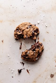 a chocolate chip cookie that has been broken in half