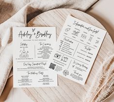 two wedding programs on a wooden platter next to a white napkin and some other items