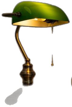 a green table lamp with a gold base