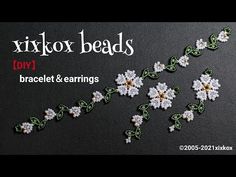 some white flowers and green leaves on a black background with the words mixox beads 1011